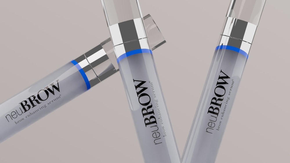neuBROW products staggered on a gray backdrop