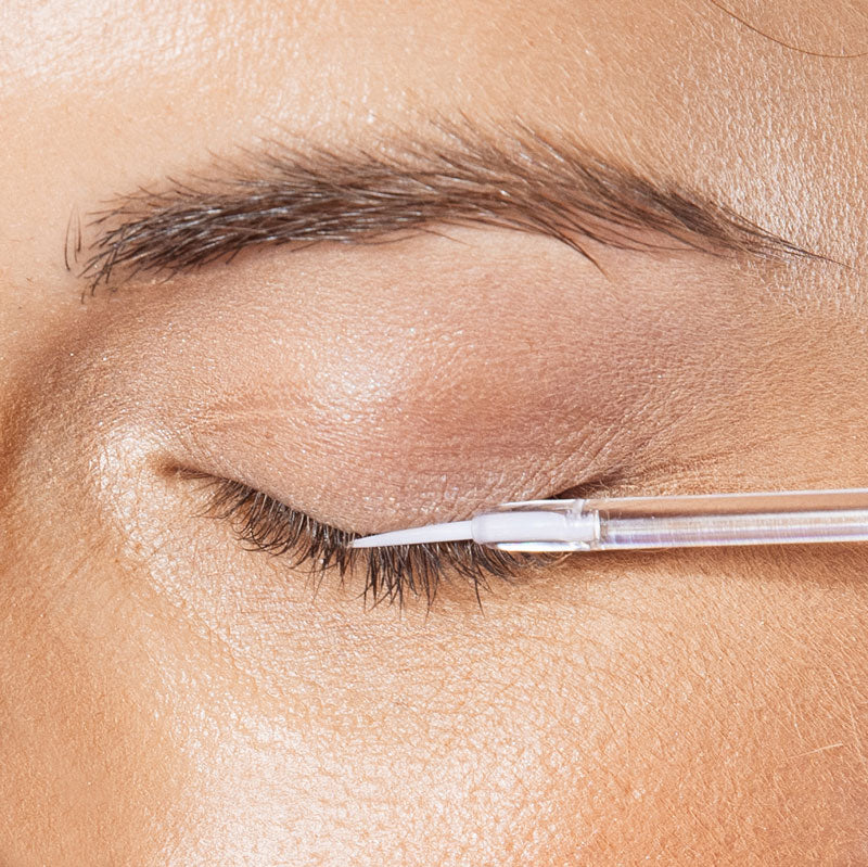 Close up photo of model applying neuLASH on eyelashes