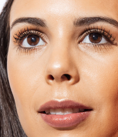 Close up photo of model looking off camera
