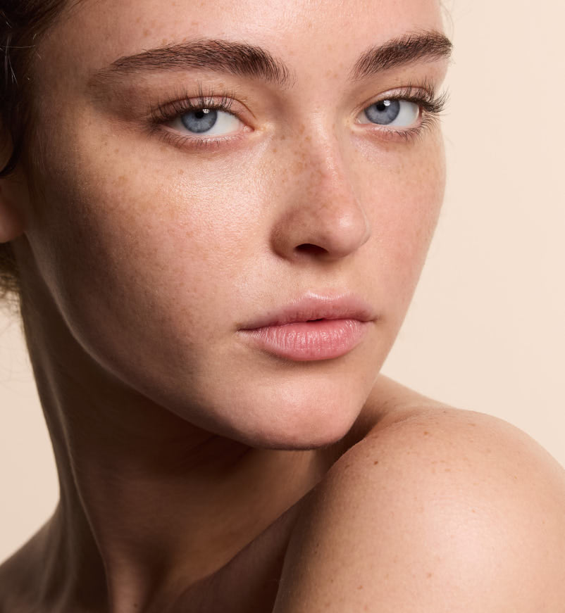 Close up photo of neuLASH® model  on a beige background